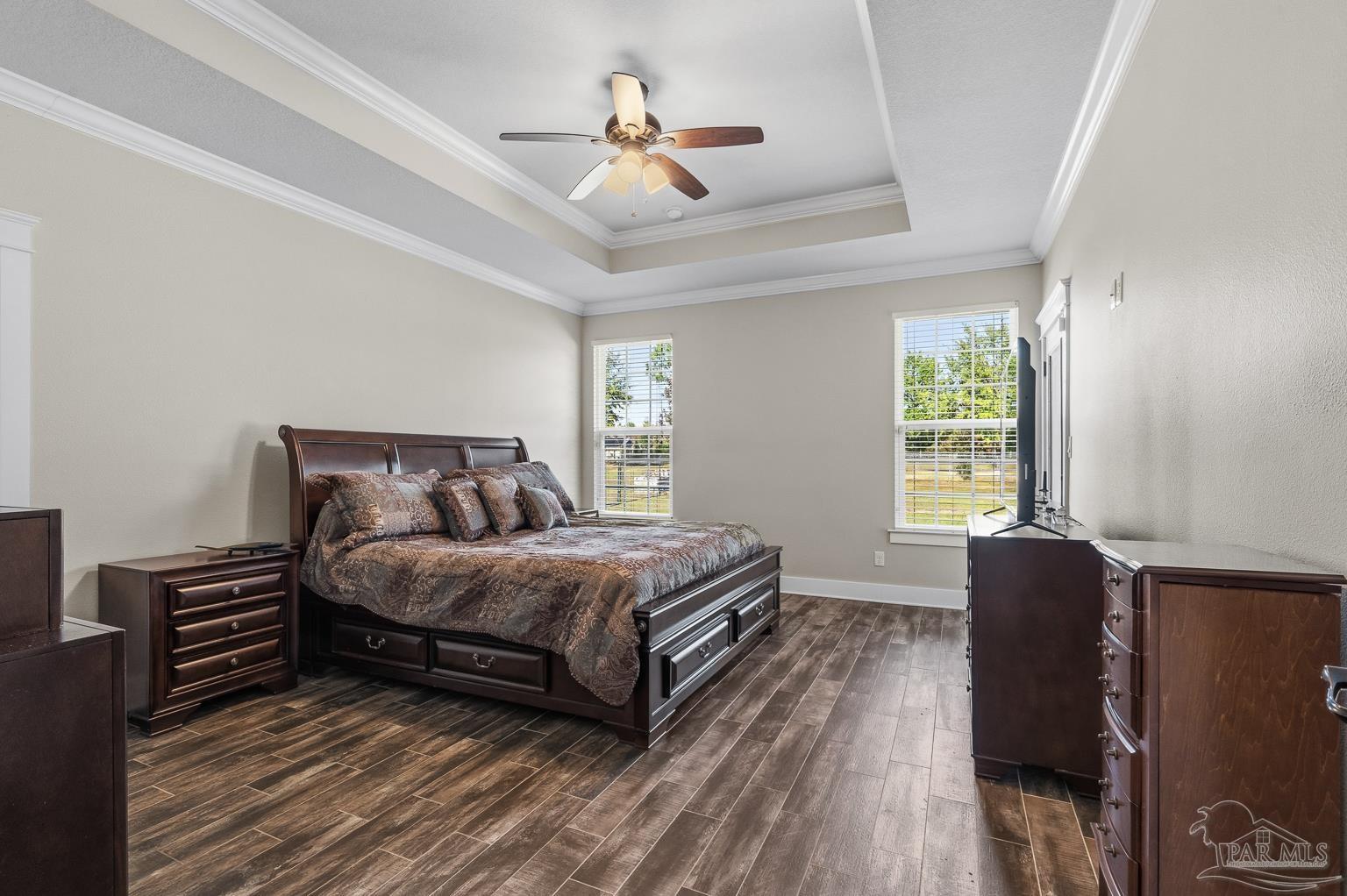 3550 Molino Road Molino, FL 32577 - Photo 26 of 68 a bedroom with bed and a chandelier