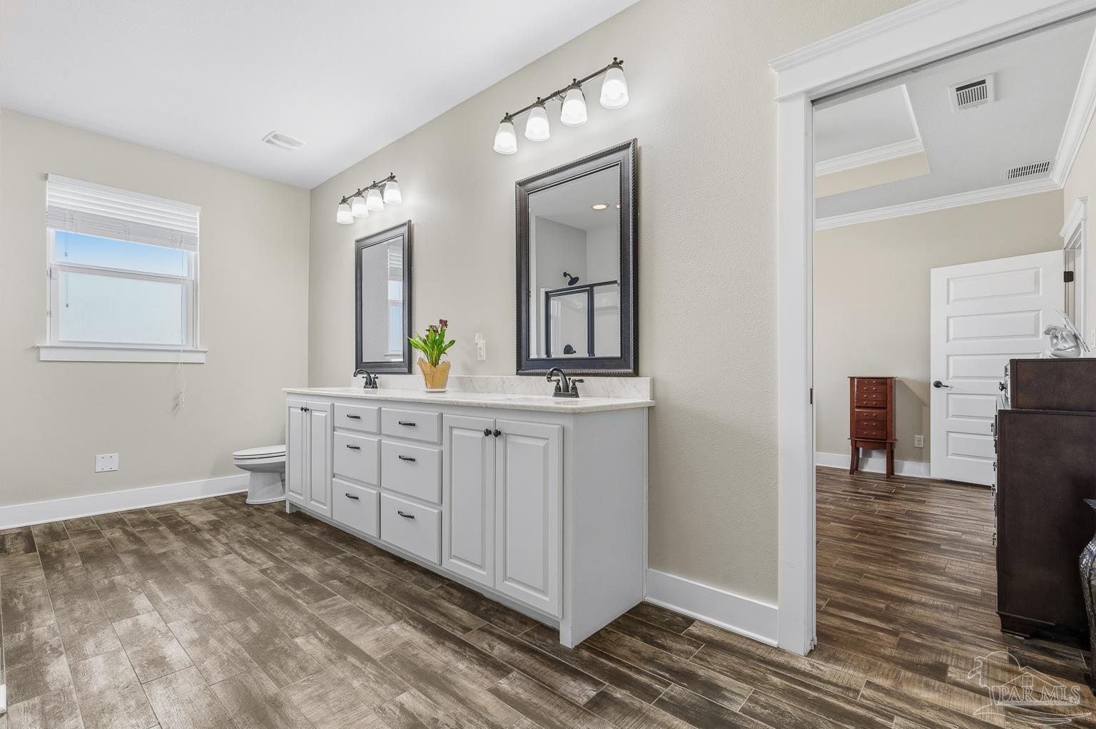 3550 Molino Road Molino, FL 32577 - Photo 30 of 68 a bathroom with a sink and a mirror