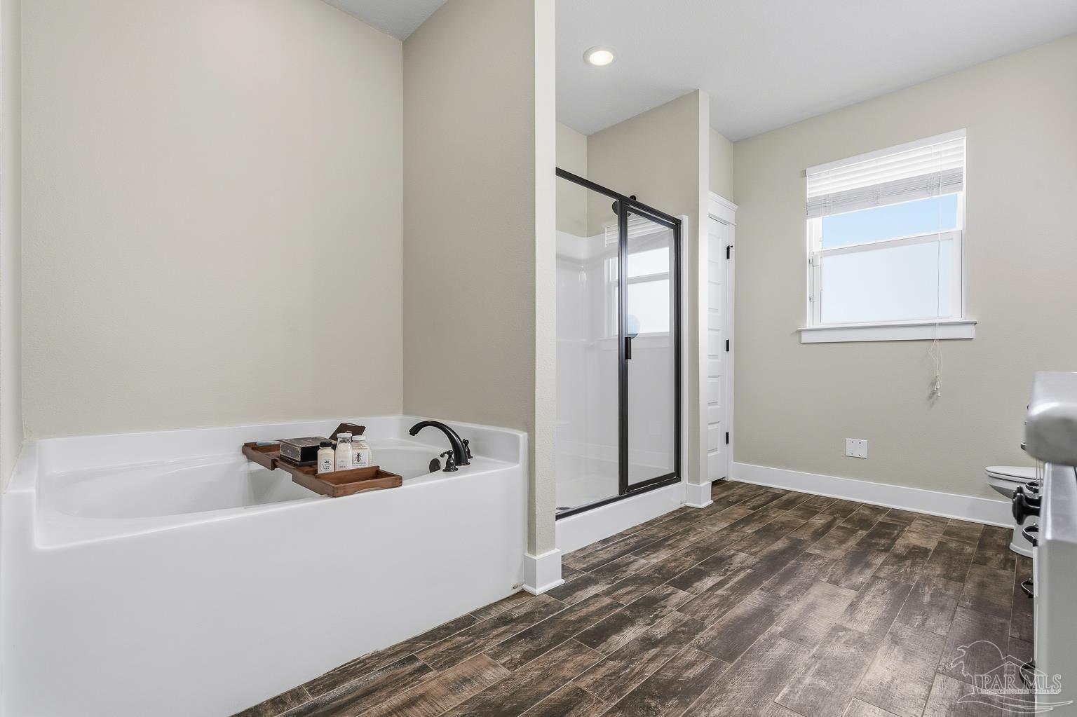 3550 Molino Road Molino, FL 32577 - Photo 32 of 68 a bathroom with a bathtub and shower