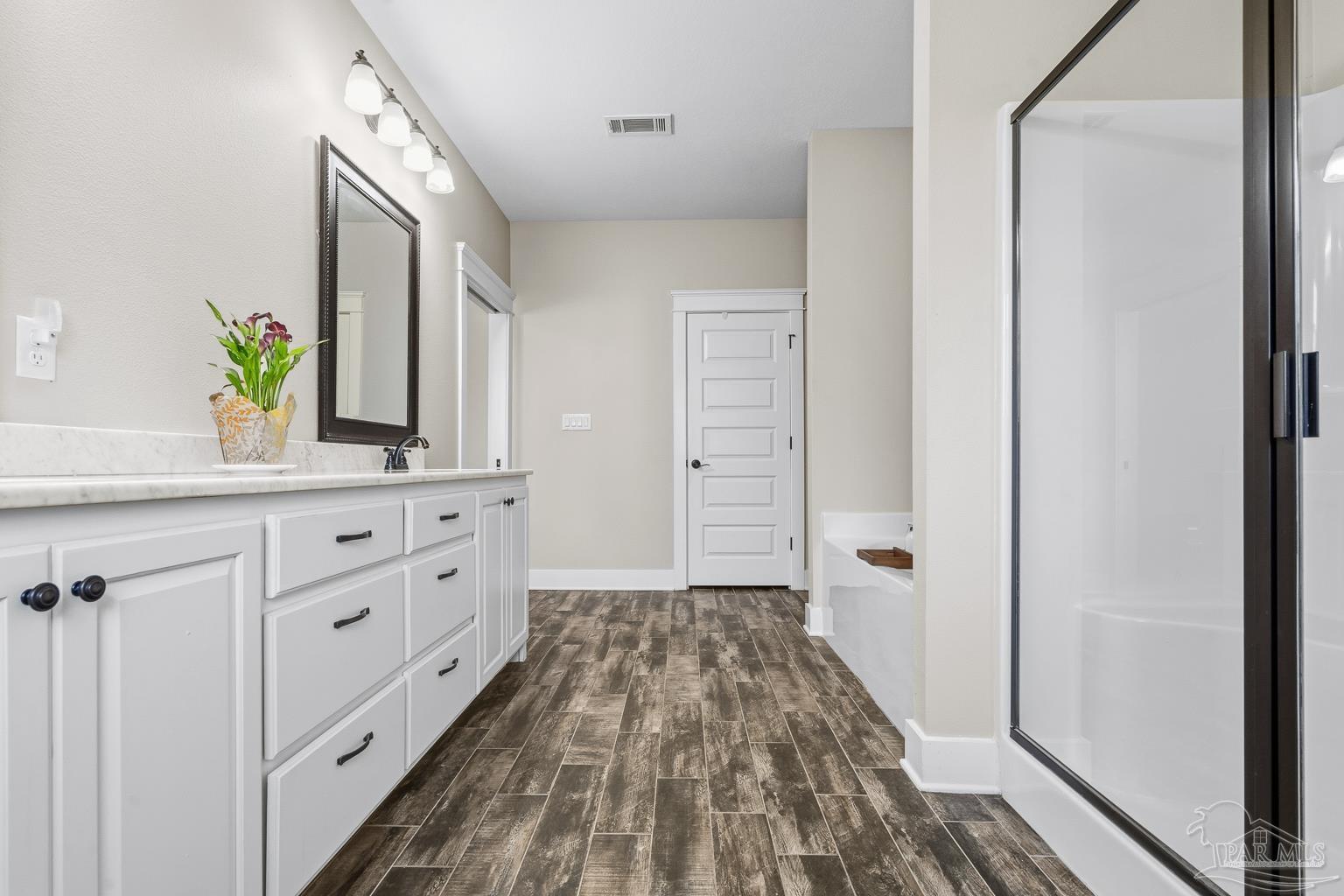 3550 Molino Road Molino, FL 32577 - Photo 33 of 68 a bathroom with a sink and a mirror
