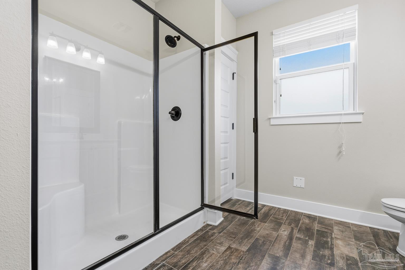 3550 Molino Road Molino, FL 32577 - Photo 34 of 68 a view of a bathroom with a glass door shower and a sink