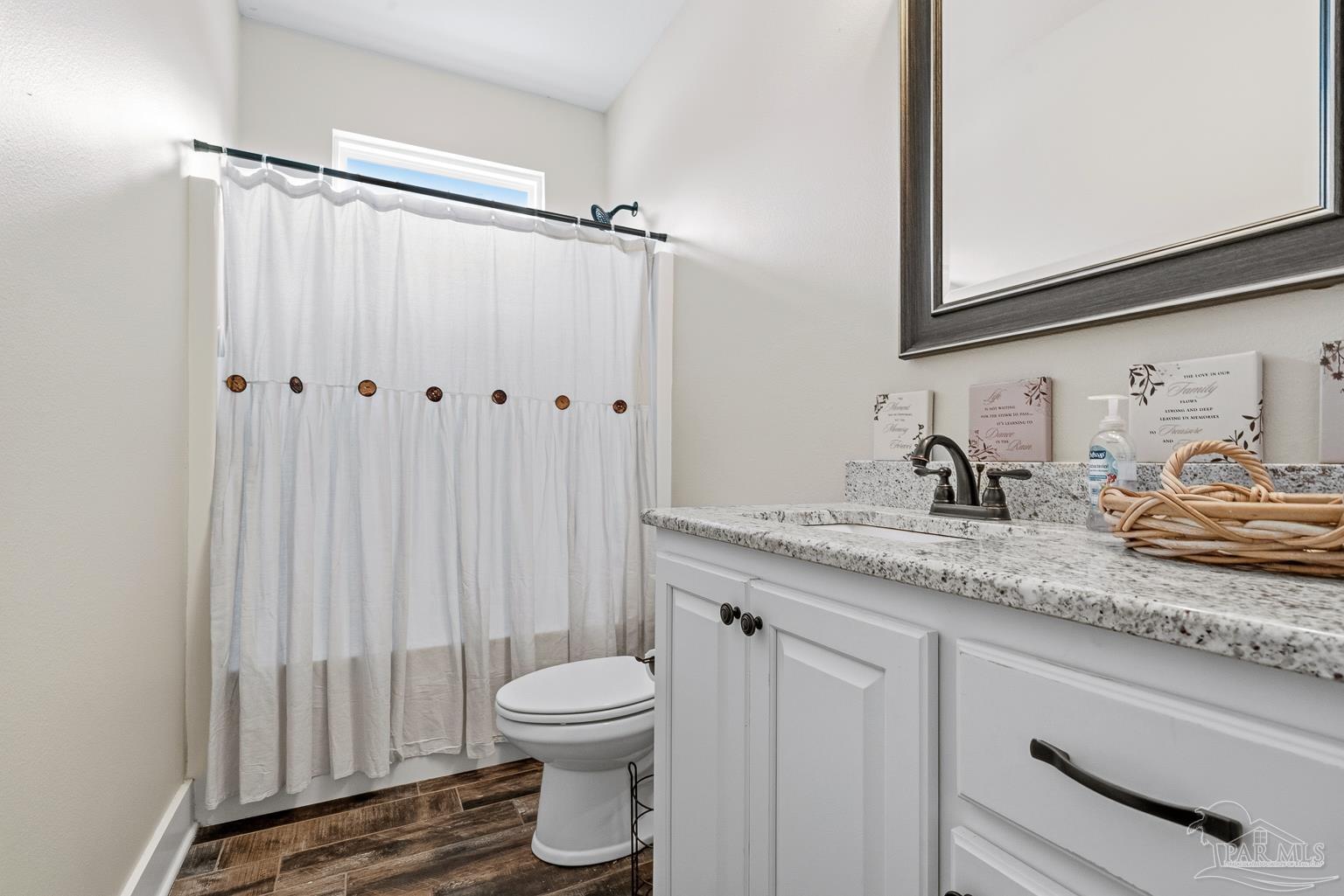 3550 Molino Road Molino, FL 32577 - Photo 41 of 68 a bathroom with a granite countertop sink and a mirror