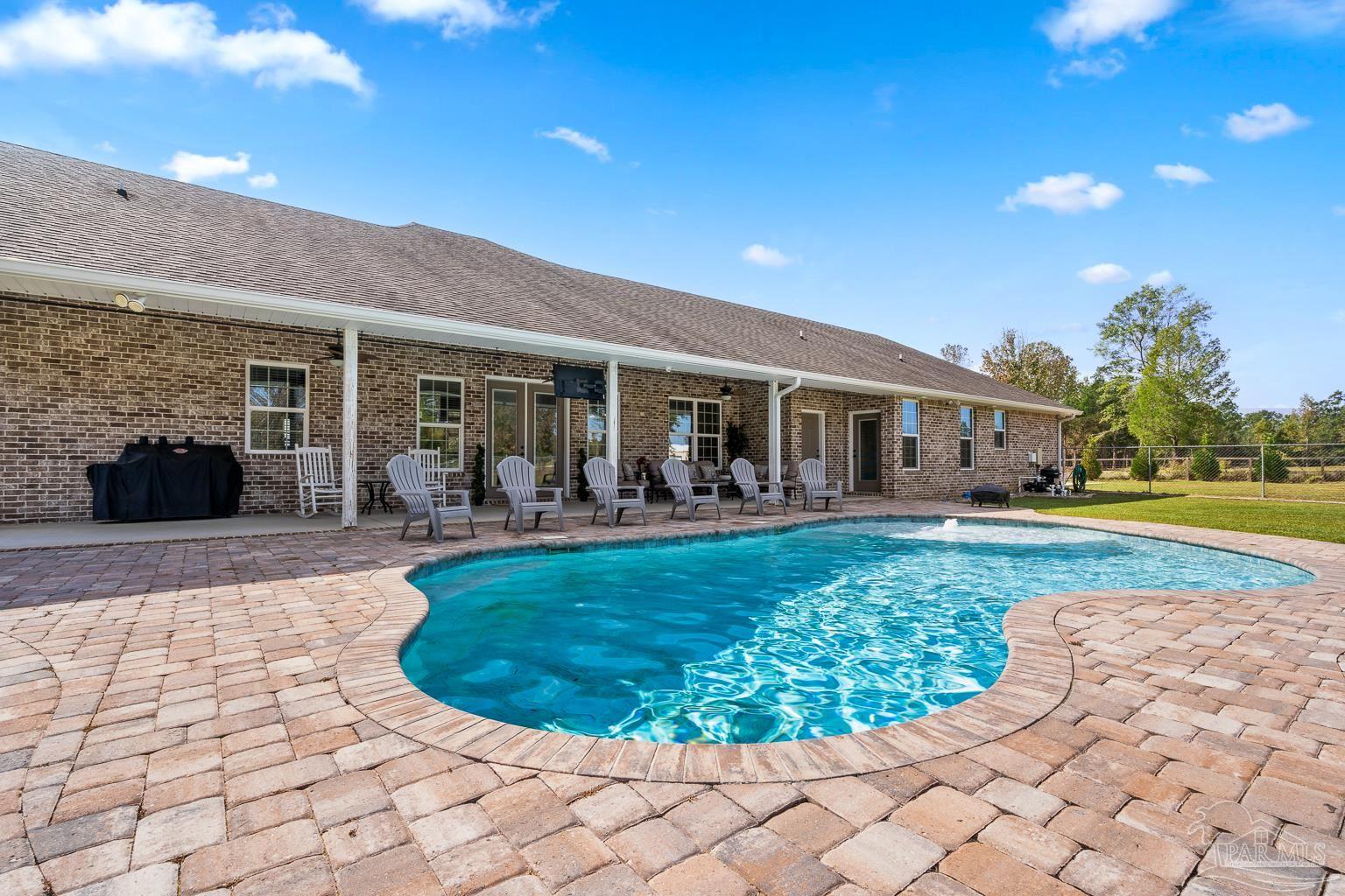 3550 Molino Road Molino, FL 32577 - Photo 52 of 68 a view of a house with backyard porch and patio