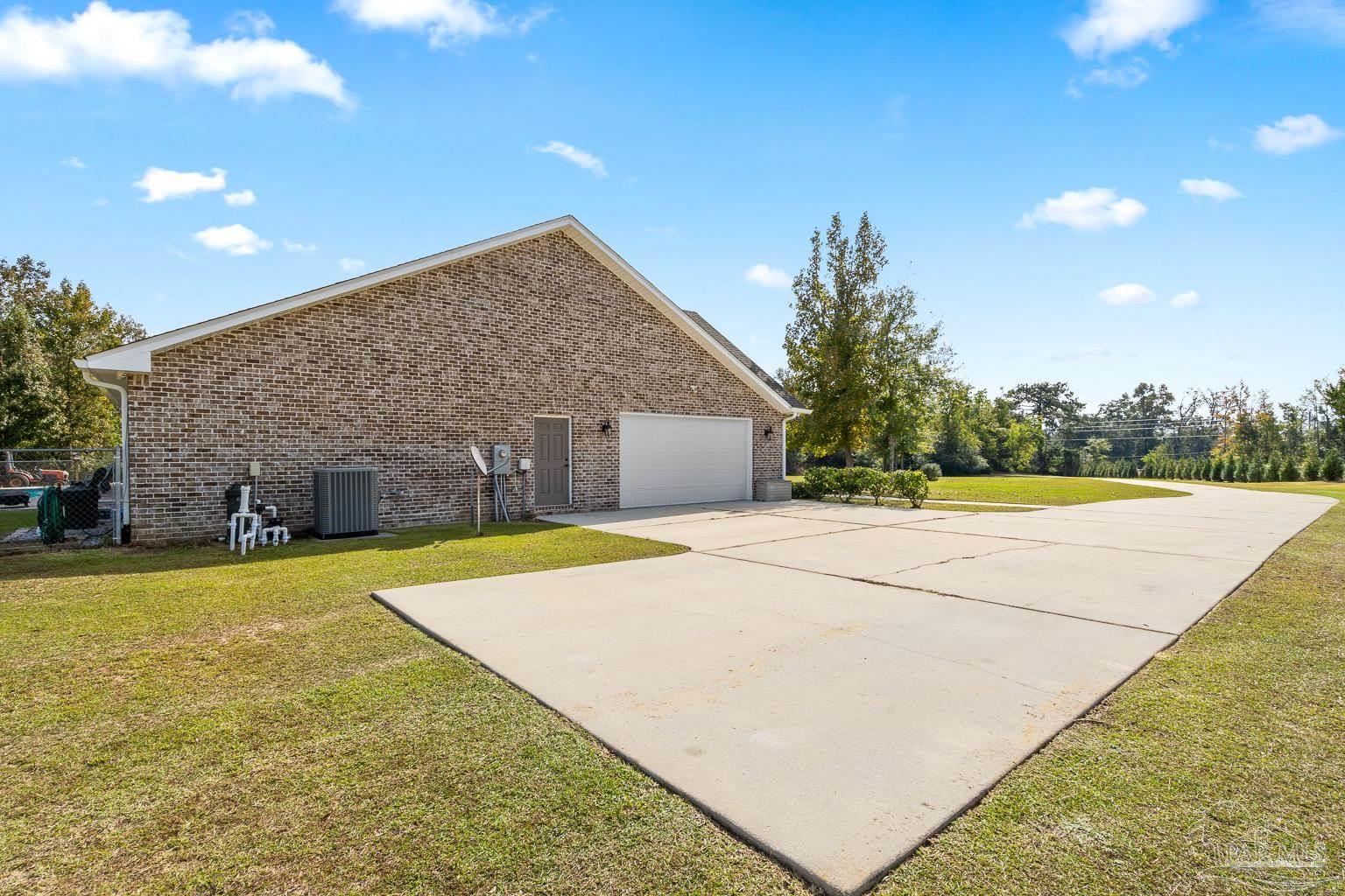 3550 Molino Road Molino, FL 32577 - Photo 57 of 68 a view of a house with pool and a yard