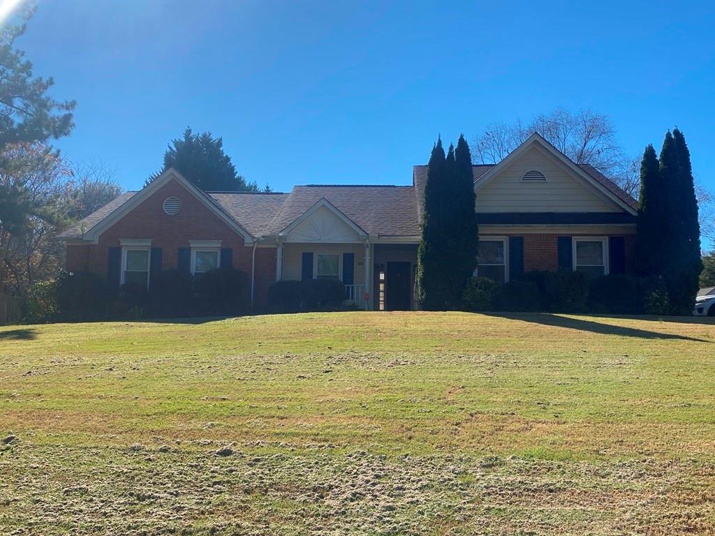 3089 Commons Crossing Snellville, GA 30078 - Photo 1 of 1 a front view of a house with a yard