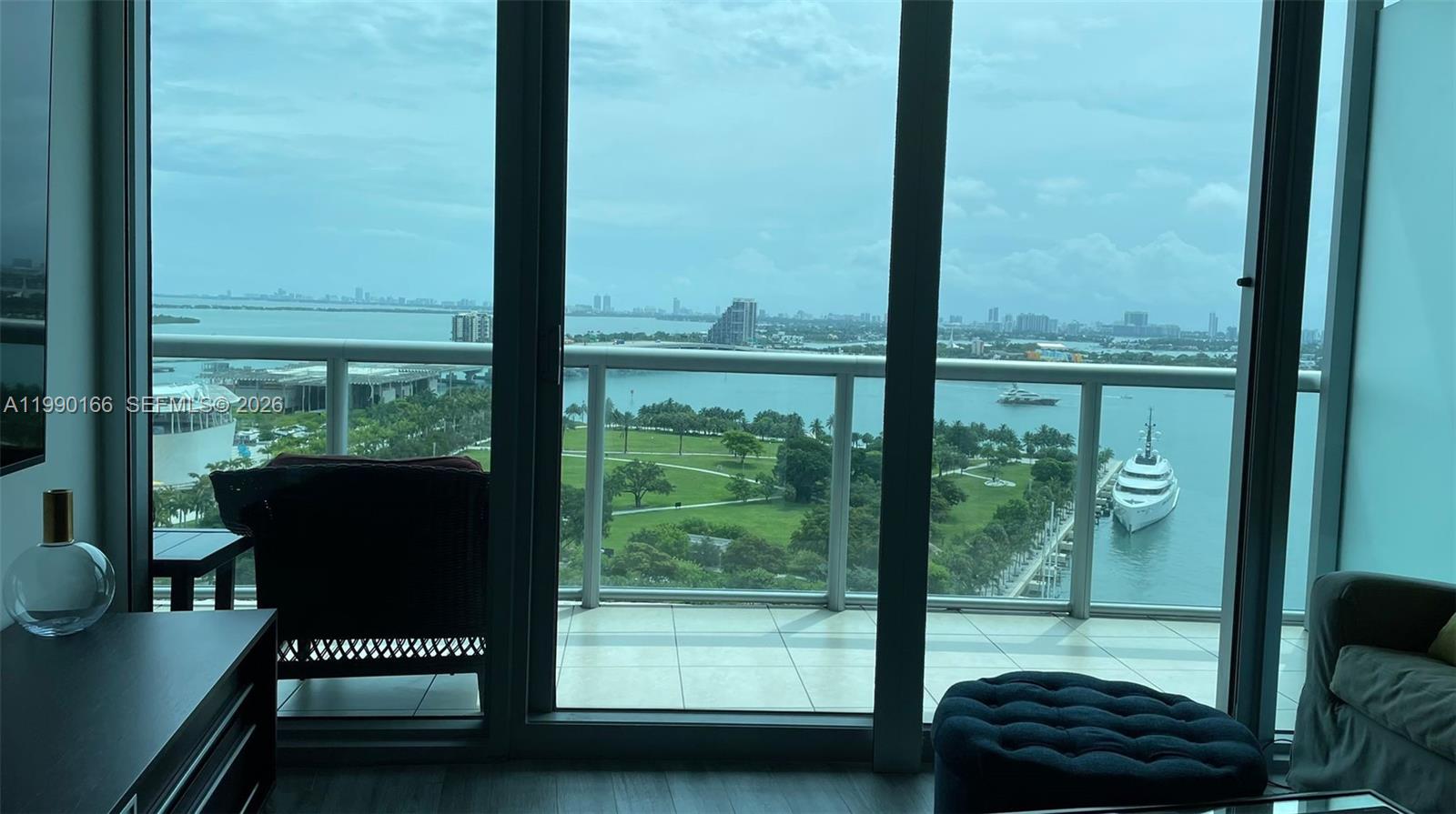 888 Biscayne Boulevard, Unit 1810 Miami, FL 33132 - Photo 10 of 28 a view of a chair and table in the balcony