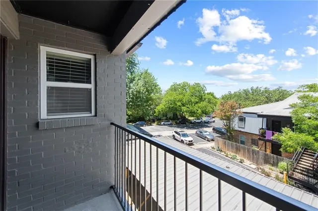 a patio with table and chairs