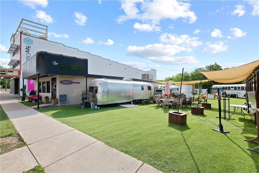2020 South Congress Avenue, Unit 1216 Austin, TX 78704 - Photo 19 of 33 a patio with table and chairs