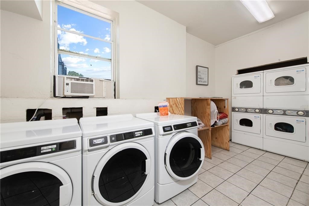 2020 South Congress Avenue, Unit 1216 Austin, TX 78704 - Photo 27 of 33 a utility room with dryer and washer