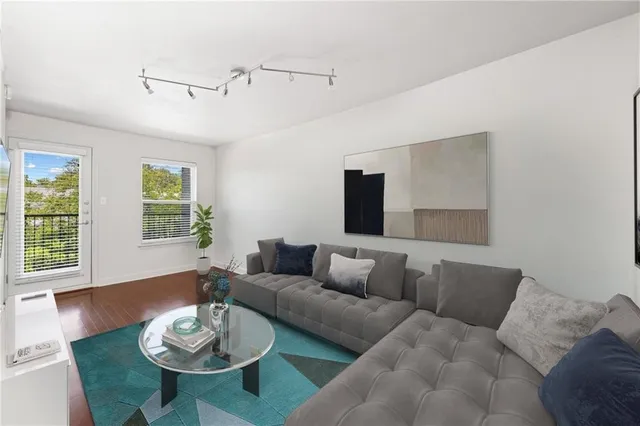 a living room with furniture and a large window