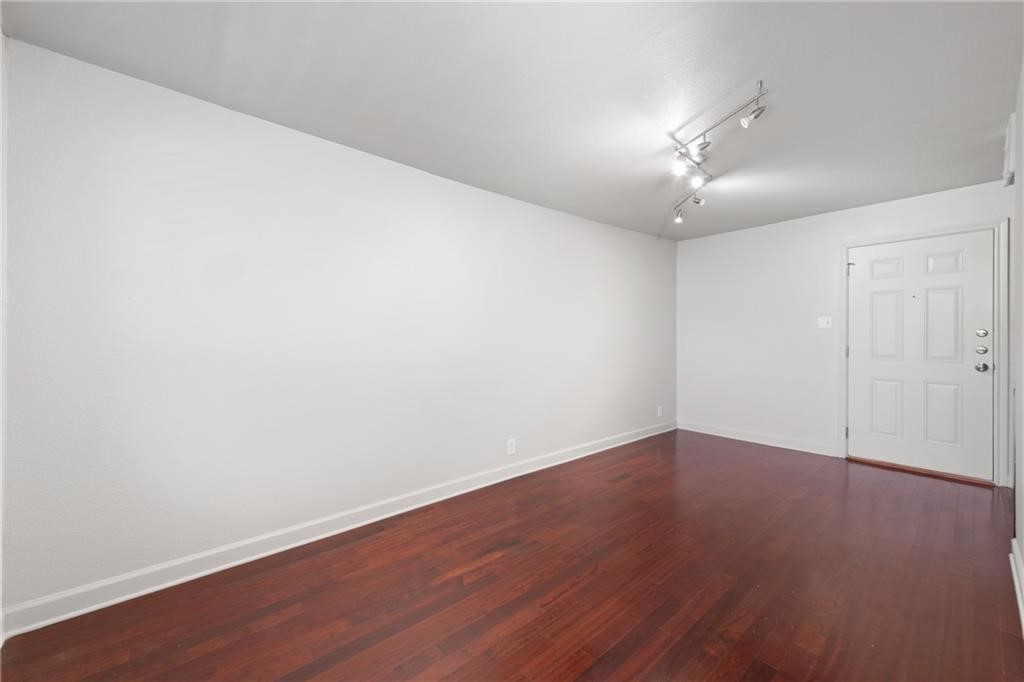 2020 South Congress Avenue, Unit 1216 Austin, TX 78704 - Photo 8 of 33 a view of an empty room with wooden floor