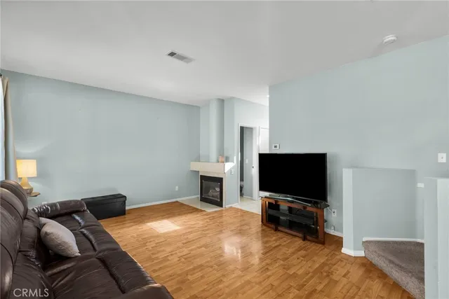 a bedroom with furniture and a flat screen tv