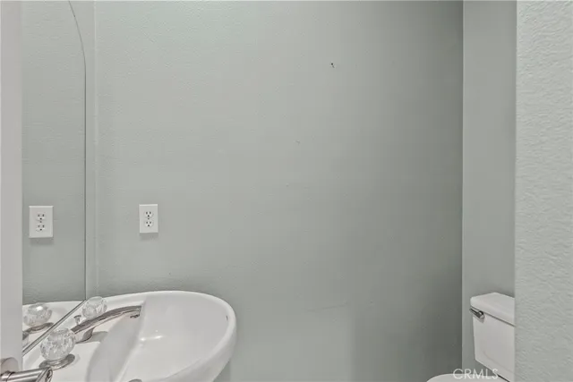 a bathroom with a sink and toilet