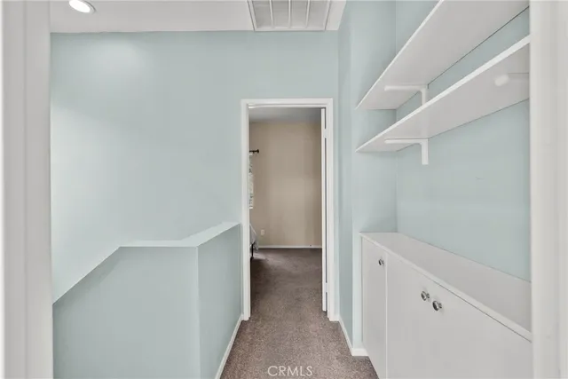 a view of an empty walk in closet
