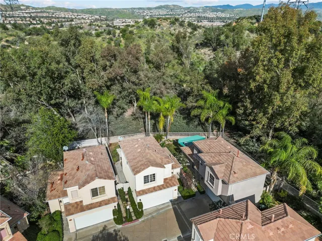 an aerial view of a house with outdoor space
