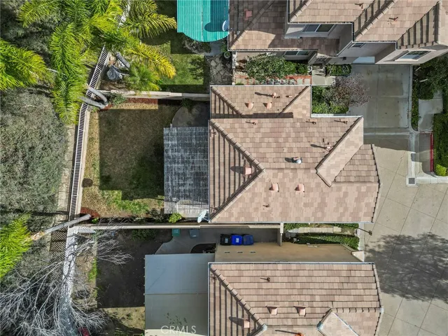 aerial view of a house with large trees