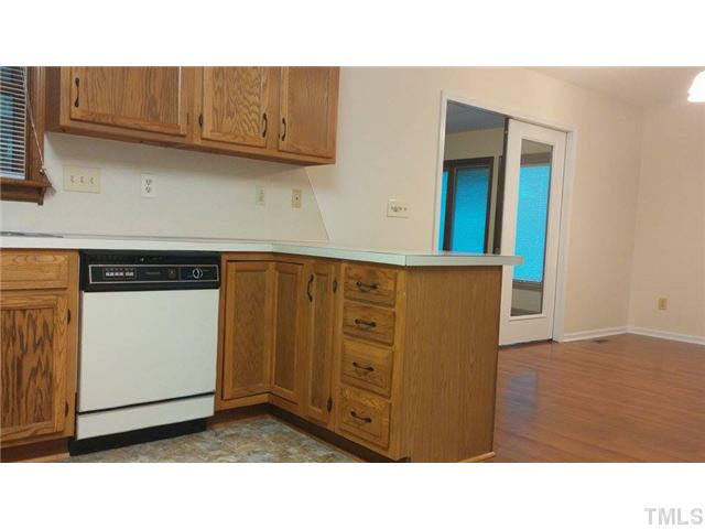 716 Stem Road Creedmoor, NC 27522 - Photo 7 of 25 kitchen view into dining/sunroom.