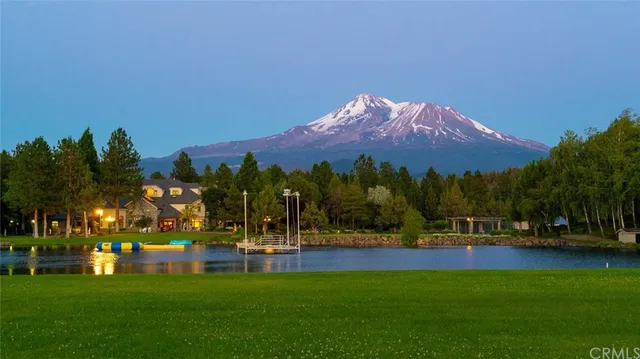 a view of swimming pool with outdoor space and lake view