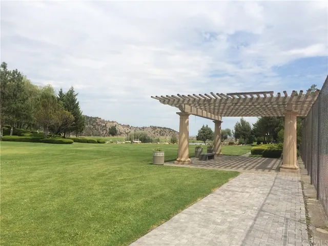 a living room with furniture fireplace and a large window