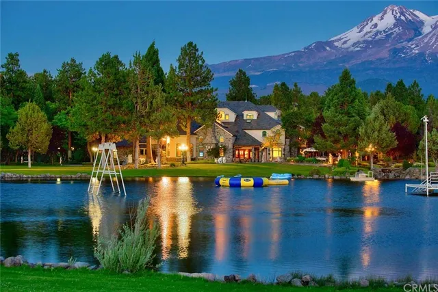 a view of a swimming pool with a table and chairs