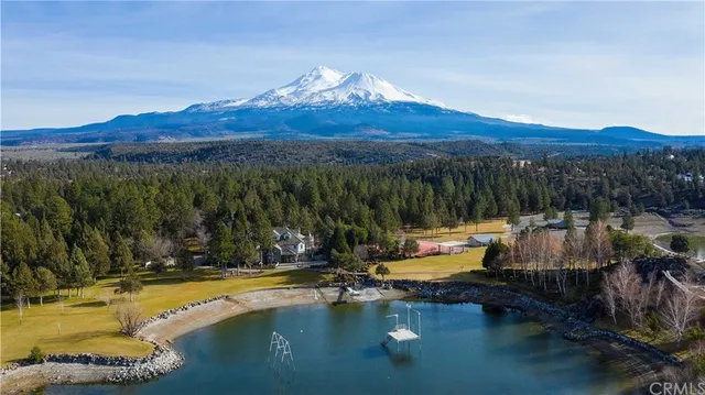 a view of a swimming pool with a mountain view in back