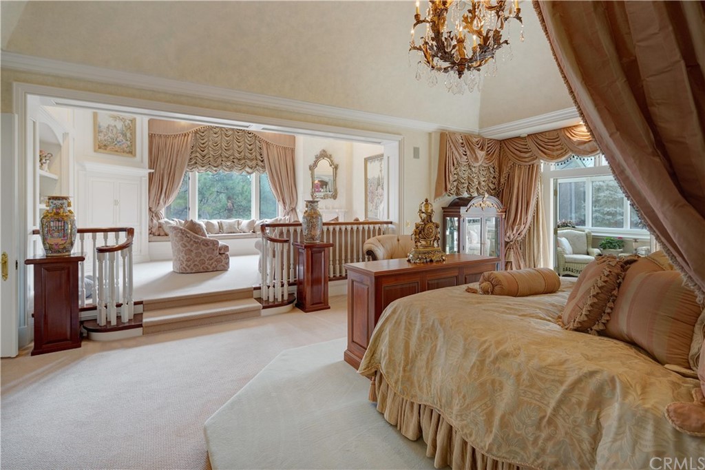 15733 Juniper Peak Road Weed, CA 96094 - Photo 51 of 74 a bed room with a bed and a chandelier