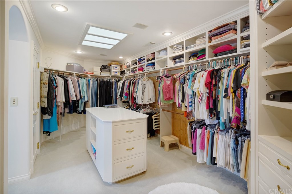 15733 Juniper Peak Road Weed, CA 96094 - Photo 57 of 74 a view of walk in closet with clothes