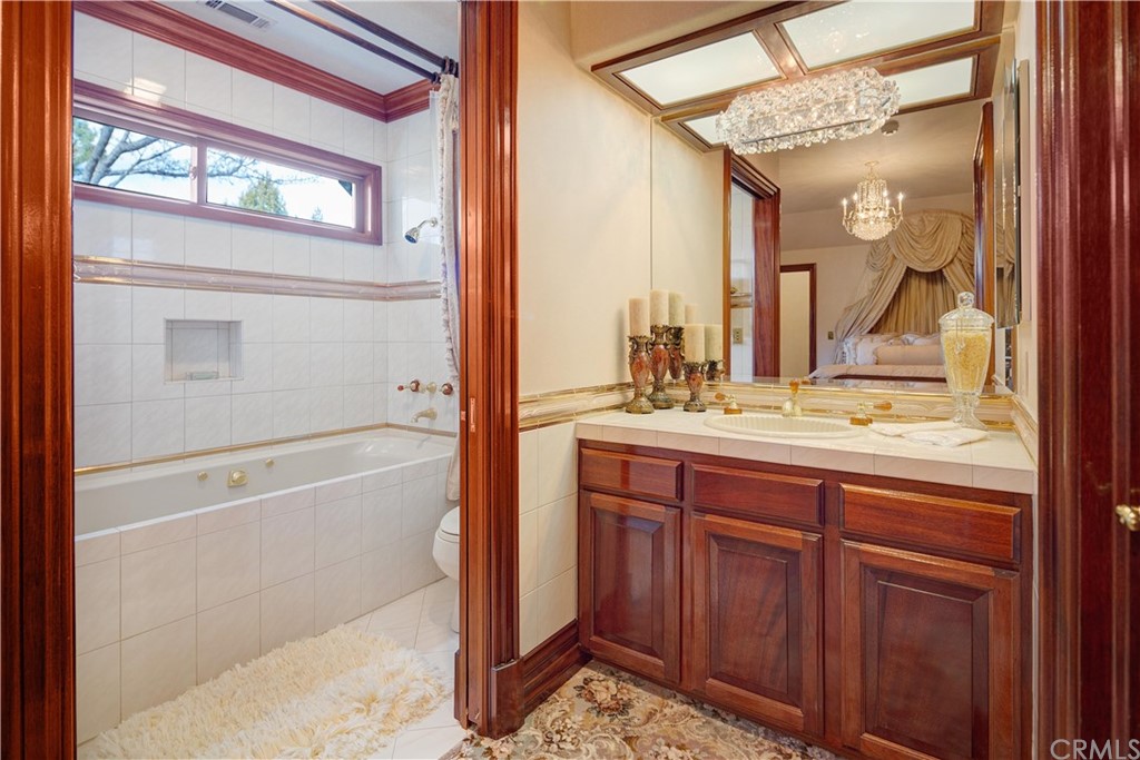 15733 Juniper Peak Road Weed, CA 96094 - Photo 68 of 74 a bathroom with a sink a mirror and a bathtub