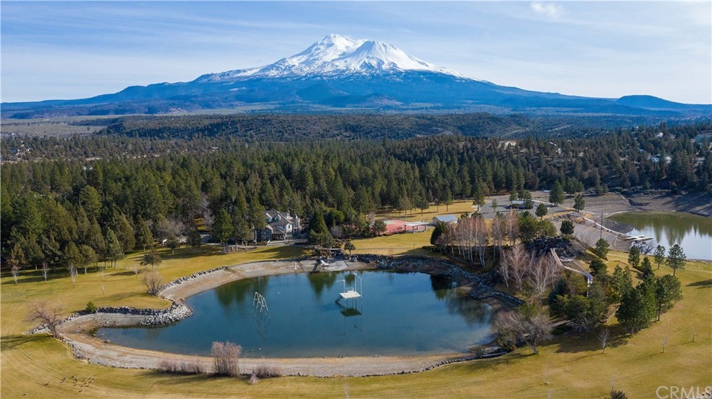 15733 Juniper Peak Road Weed, CA 96094 - Photo 9 of 74 a view of a lake with a mountain