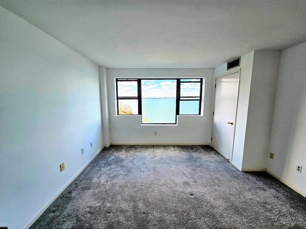 3 Seal Harbor Road, Unit 634 Winthrop, MA 02152 - Photo 3 of 8 an empty room with windows