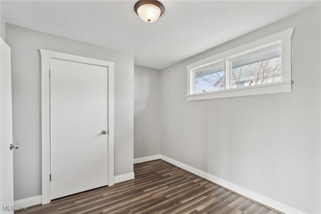 311 Warren Road Newton Falls, OH 44444 - Photo 13 of 30 Spare room with dark wood-type flooring