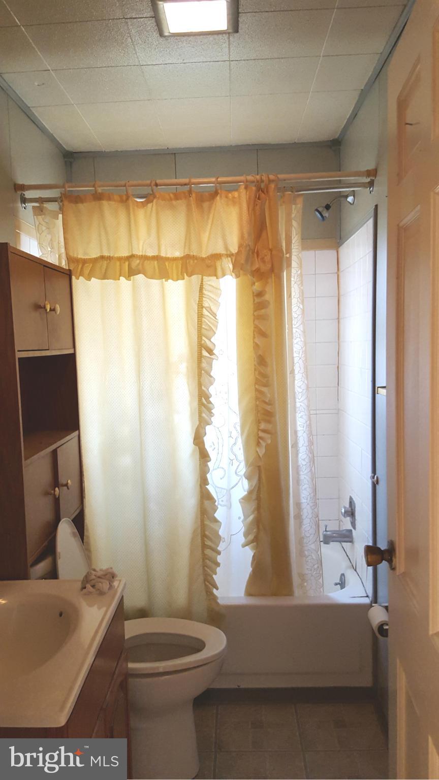 3701 Damascus Road Brookeville, MD 20833 - Photo 12 of 15 a bathroom with a sink a toilet and a bathtub