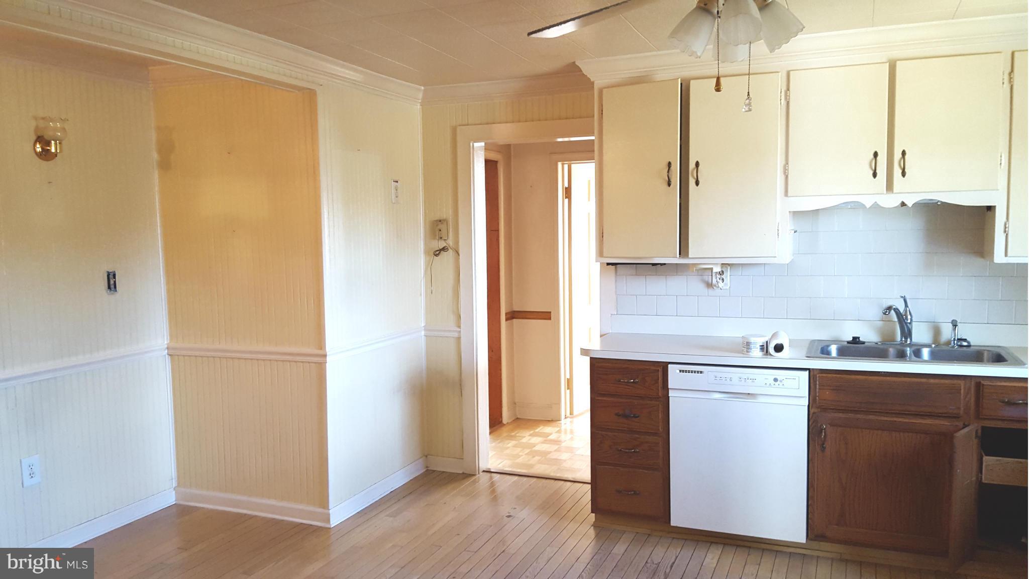 3701 Damascus Road Brookeville, MD 20833 - Photo 9 of 15 a kitchen with a sink a refrigerator and cabinets