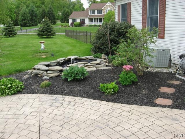 195 West Butternut Road Hellertown, PA 18055 - Photo 22 of 23 a view of a garden with a house