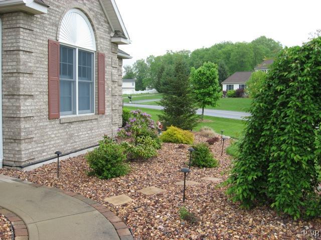 195 West Butternut Road Hellertown, PA 18055 - Photo 4 of 23 a front view of a house with garden