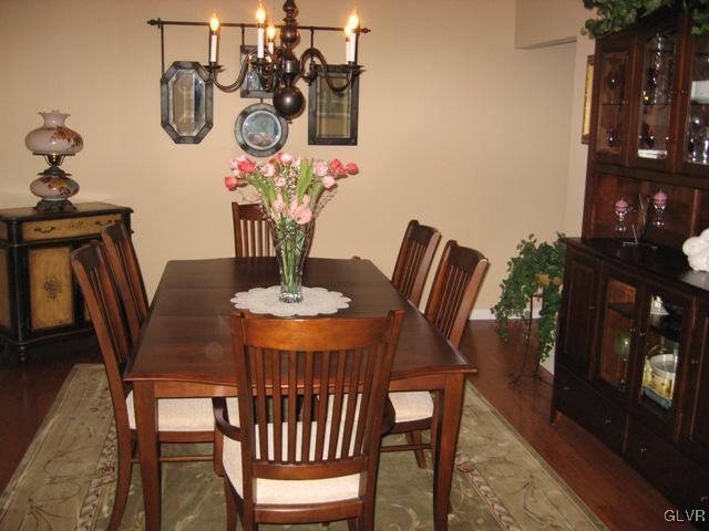 195 West Butternut Road Hellertown, PA 18055 - Photo 9 of 23 a dining room with furniture a chandelier and wooden floor