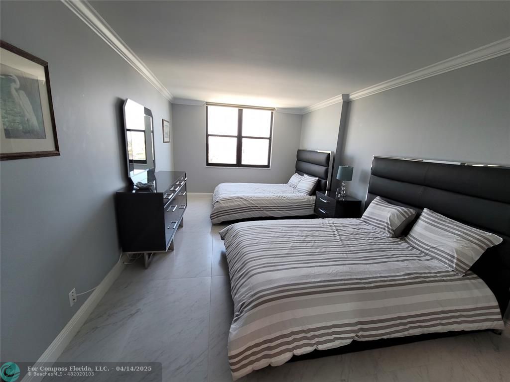 1500 North Ocean Boulevard, Unit 901 Pompano Beach, FL 33062 - Photo 18 of 19 a bedroom with double bed and a window