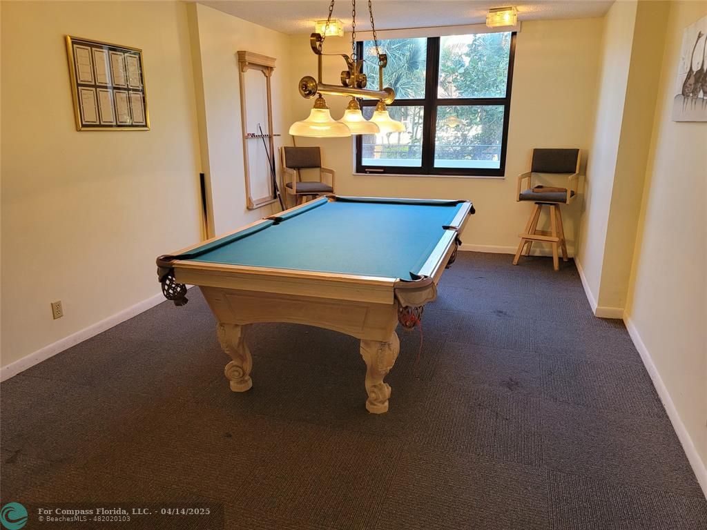 1500 North Ocean Boulevard, Unit 901 Pompano Beach, FL 33062 - Photo 5 of 19 a room with pool table and windows