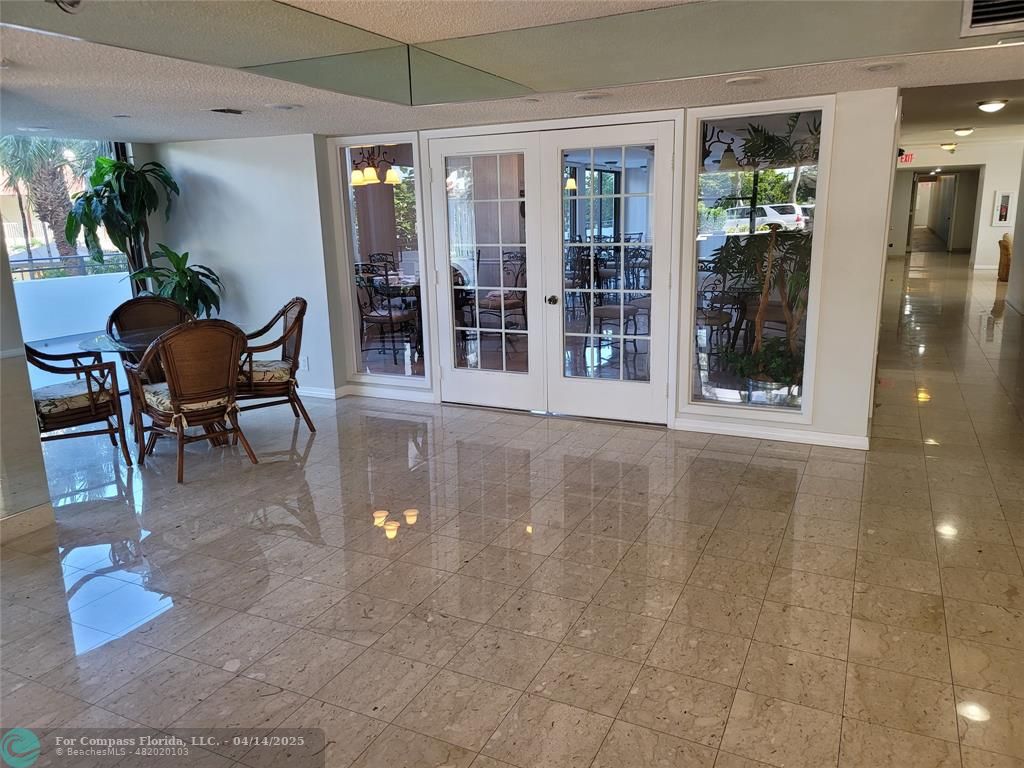 1500 North Ocean Boulevard, Unit 901 Pompano Beach, FL 33062 - Photo 7 of 19 a view of a livingroom with furniture and window