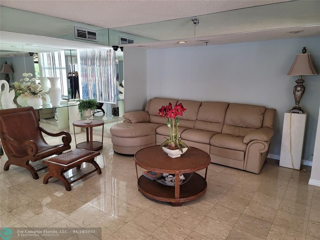 1500 North Ocean Boulevard, Unit 901 Pompano Beach, FL 33062 - Photo 8 of 19 a living room with furniture and a couch