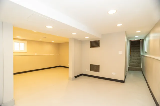 a view of a small space with wooden floor