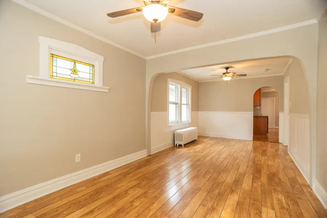 a view of a livingroom with a dishwasher and furniture