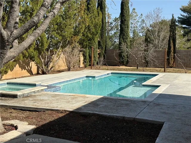 a view of a backyard of the house
