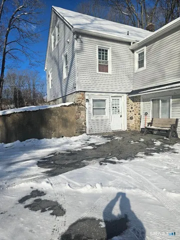 a view of a house with a street