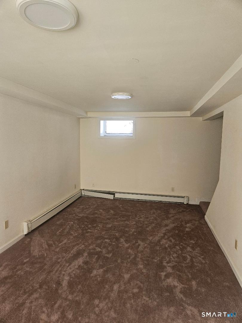 1129 Southford Road Middlebury, CT 06762 - Photo 4 of 7 a view of an empty room and window