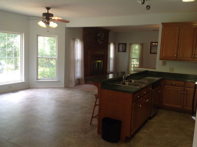 524 Chambers Road Macon, GA 31217 - Photo 14 of 42 a kitchen with a sink stove and cabinets