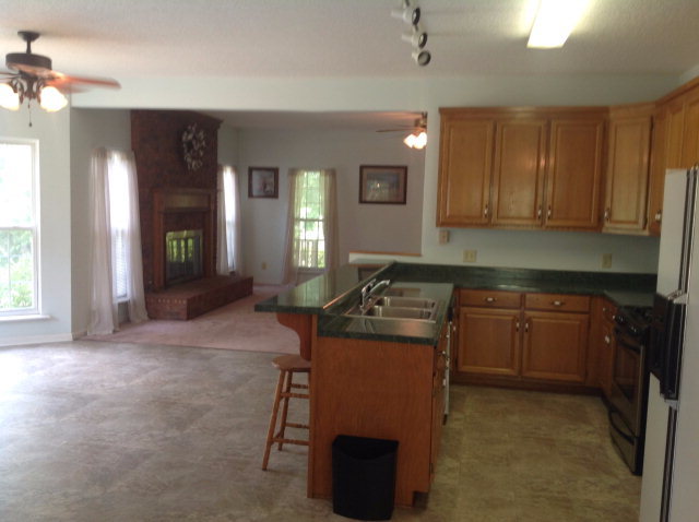 524 Chambers Road Macon, GA 31217 - Photo 8 of 42 a kitchen with cabinets and window