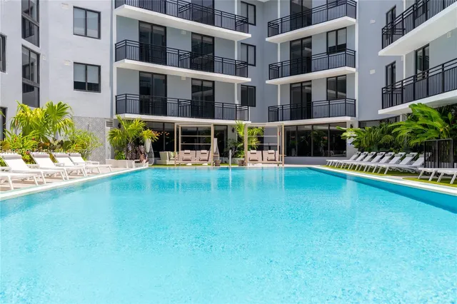 a view of a swimming pool with a porch