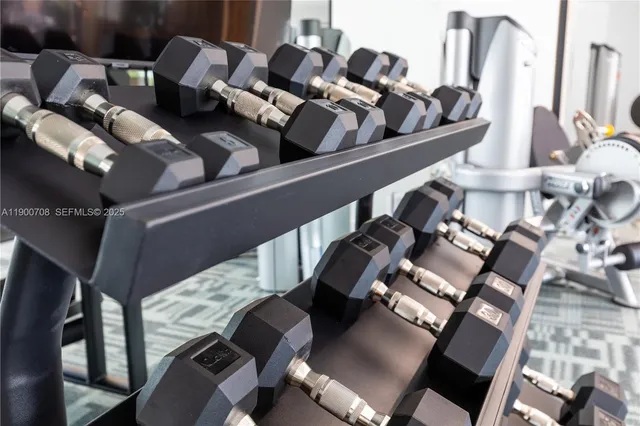 a living room with kitchen island furniture and a potted plant