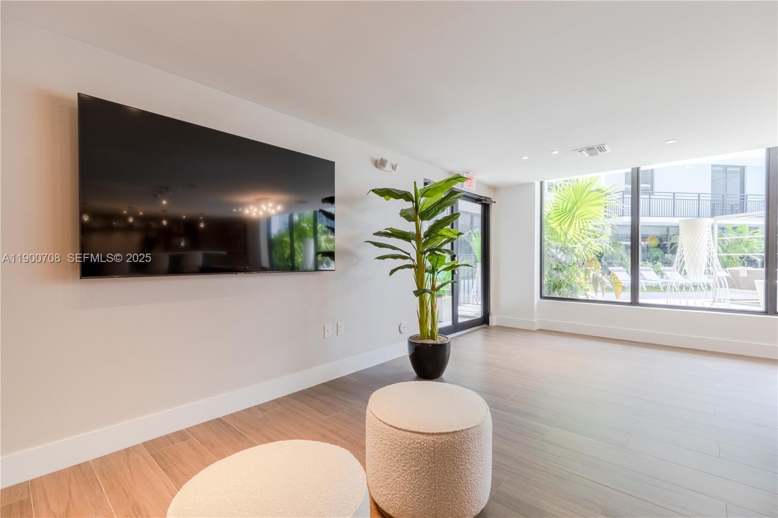 1005 Spring Garden Road, Unit 220 Miami, FL 33136 - Photo 24 of 35 a living room with furniture and a potted plant